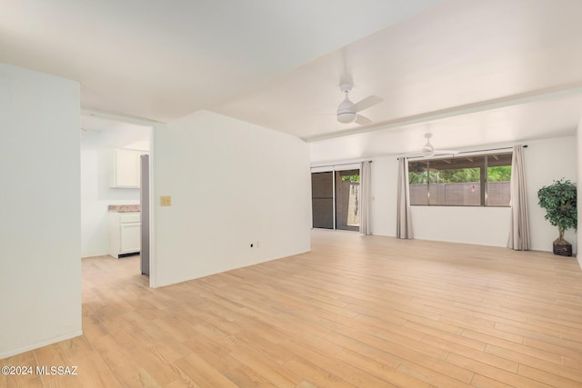 unfurnished room with ceiling fan and light wood-type flooring