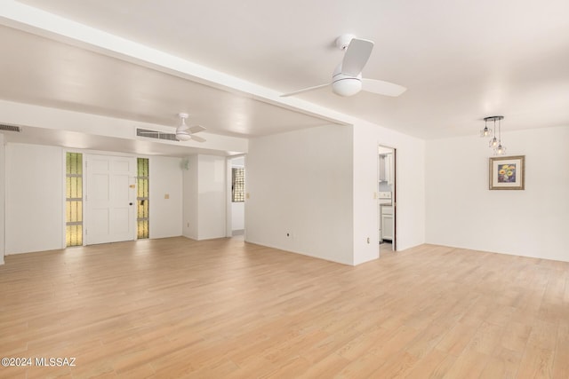 spare room featuring ceiling fan and light wood-type flooring