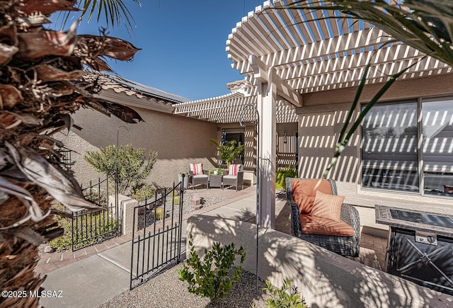 view of patio / terrace with outdoor lounge area and a pergola