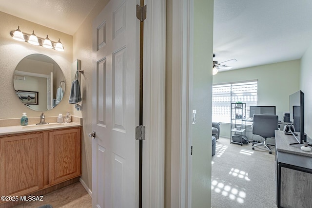 bathroom with vanity and ceiling fan