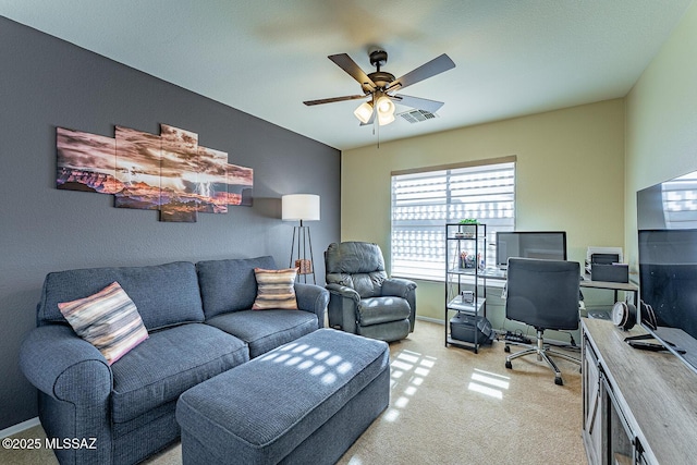 carpeted home office with ceiling fan