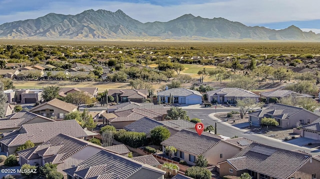 birds eye view of property with a mountain view