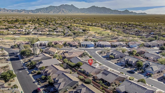 birds eye view of property featuring a mountain view