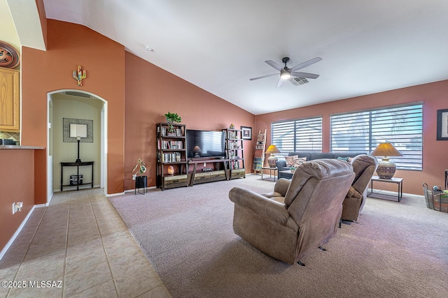 carpeted living room featuring high vaulted ceiling and ceiling fan