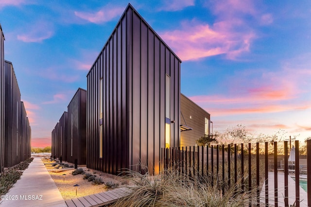 view of property exterior at dusk