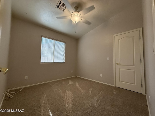 spare room with ceiling fan, carpet floors, and lofted ceiling