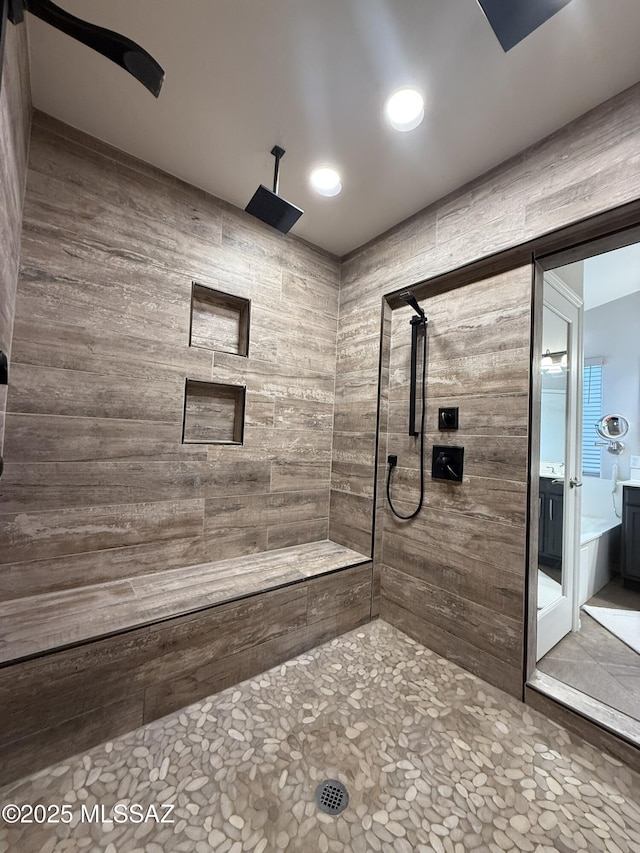 bathroom featuring tiled shower