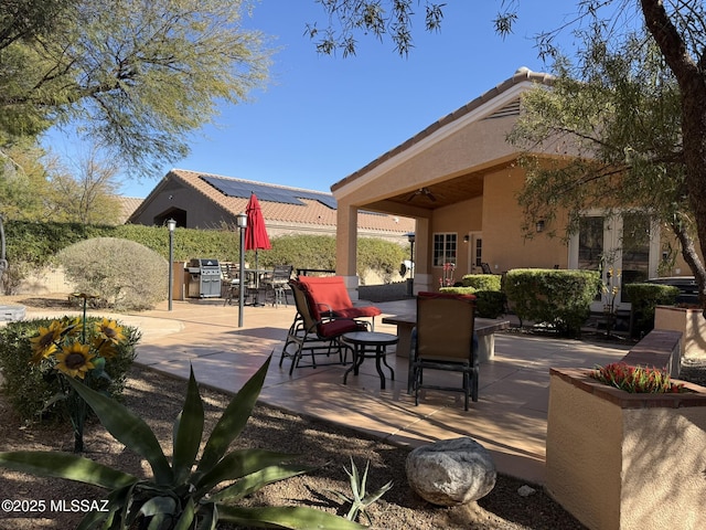 view of patio / terrace featuring ceiling fan and area for grilling