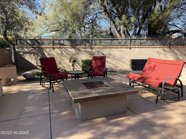 view of patio featuring an outdoor fire pit