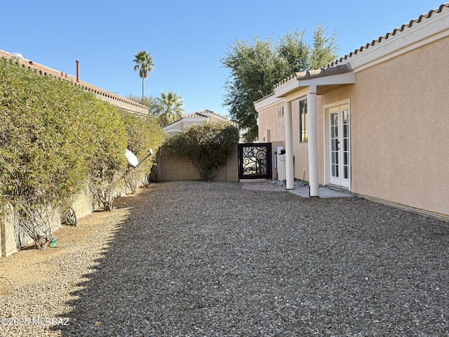 view of yard featuring french doors