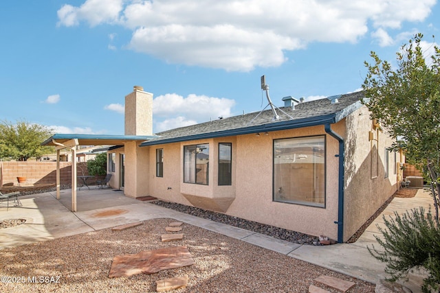 back of property with a patio and central air condition unit