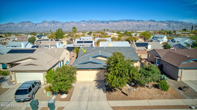 birds eye view of property featuring a mountain view