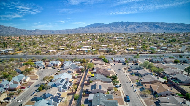 birds eye view of property featuring a mountain view