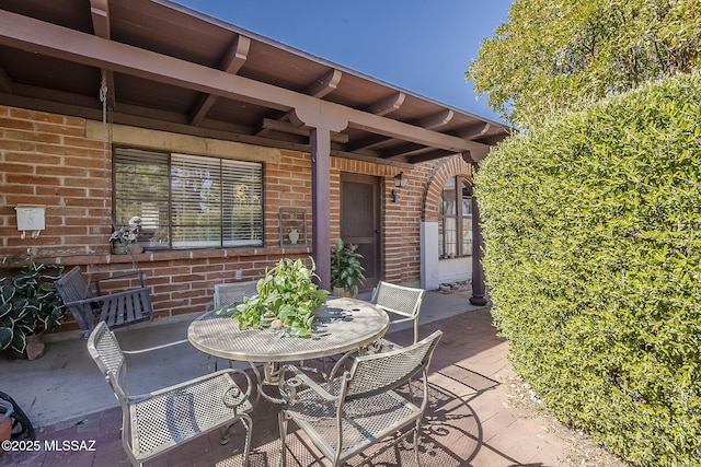 view of patio featuring outdoor dining area