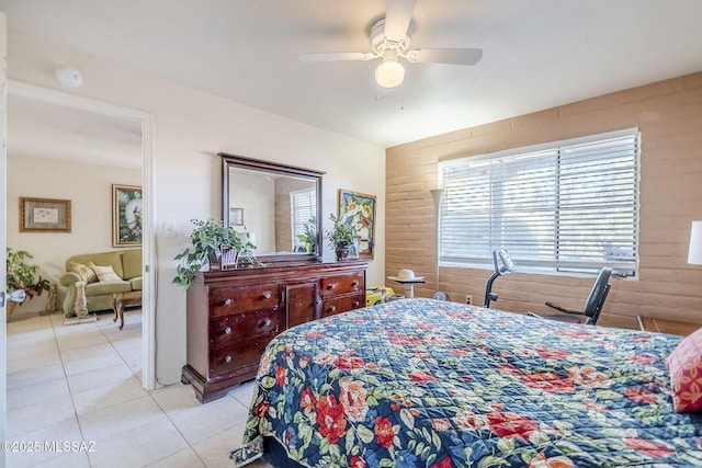 bedroom with ceiling fan and tile patterned floors