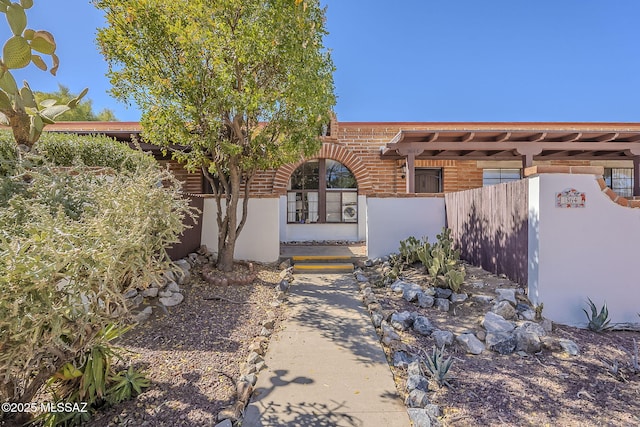 property entrance featuring fence