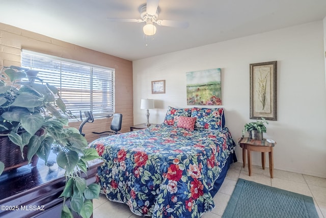 bedroom with ceiling fan and tile patterned floors