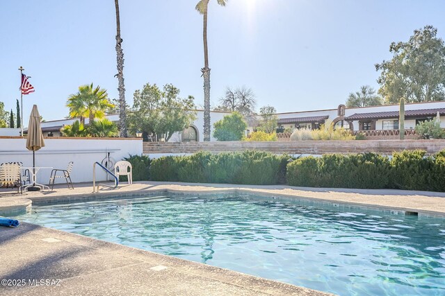 outdoor pool with a patio