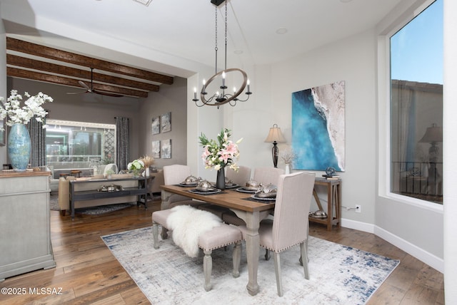 dining space featuring dark wood-style floors, baseboards, and beam ceiling