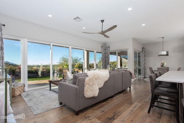 living room featuring recessed lighting, visible vents, dark wood finished floors, and ceiling fan