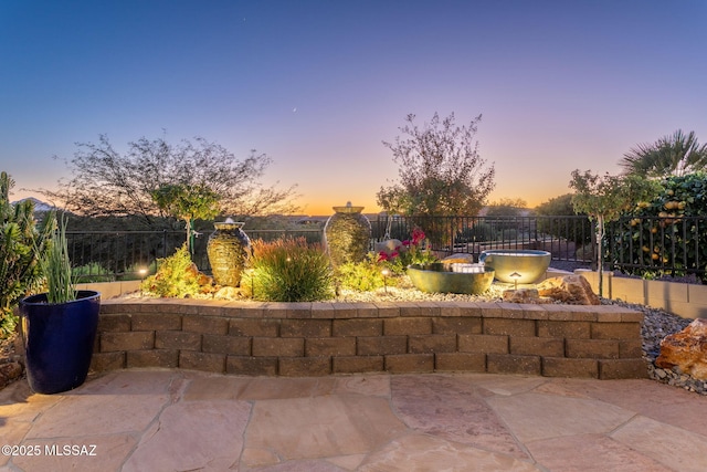 patio terrace at dusk with fence