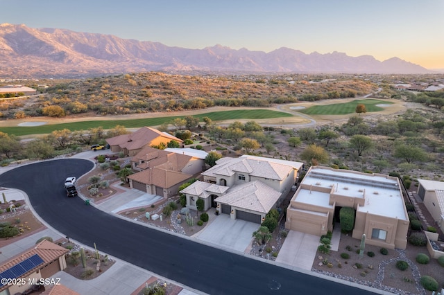 aerial view at dusk with a residential view and a mountain view