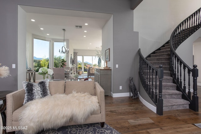 living room with a chandelier, recessed lighting, visible vents, baseboards, and dark wood-style floors