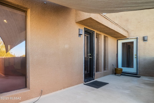 doorway to property featuring a patio