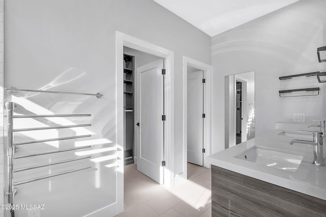 bathroom with tile patterned floors and sink