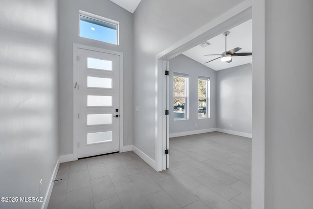 entryway featuring ceiling fan and lofted ceiling