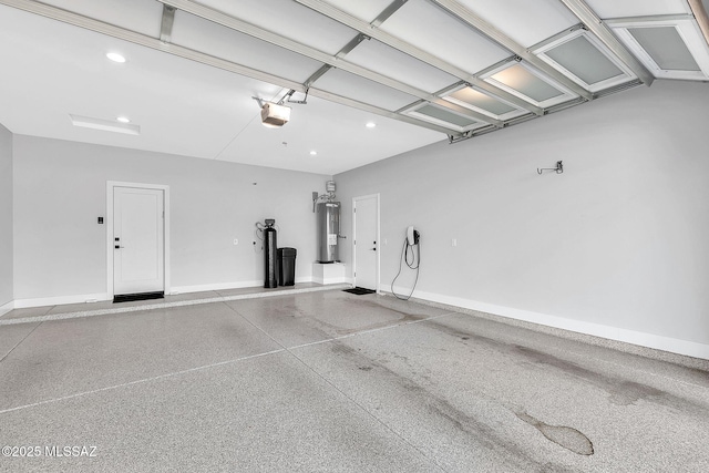 garage featuring water heater and a garage door opener