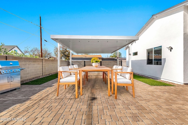 view of patio with a grill