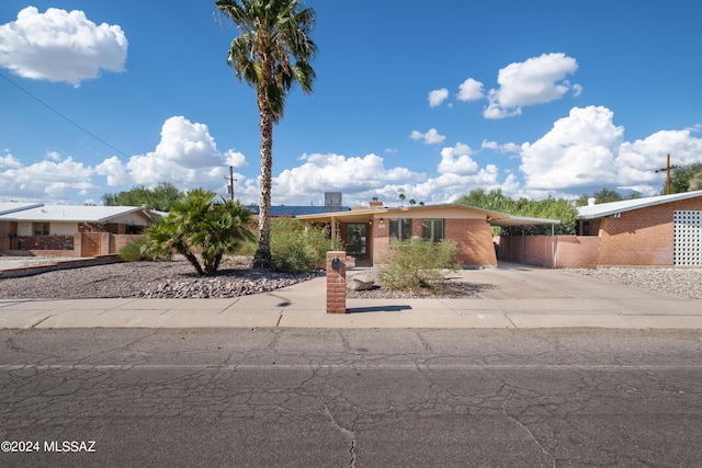 view of front facade with a carport