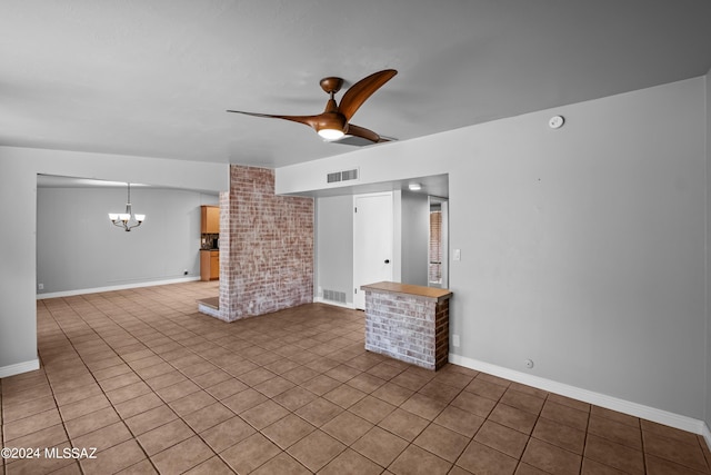 unfurnished living room with light tile patterned flooring and ceiling fan with notable chandelier