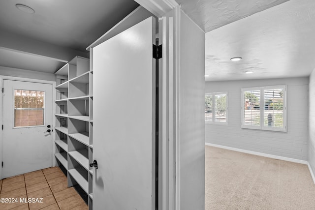 spacious closet featuring light tile patterned floors