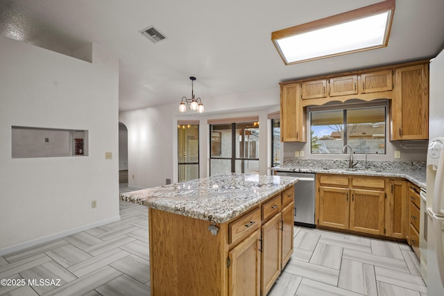 3873 W Allred St, Thatcher, AZ 85552 - kitchen with dishwasher, a sink, arched walkways, and light stone counters