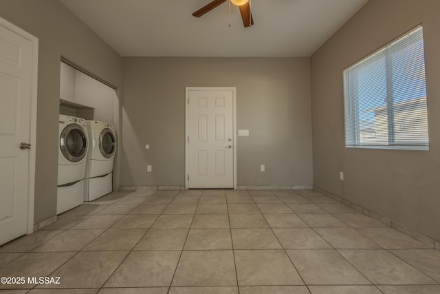 clothes washing area with separate washer and dryer, light tile patterned floors, and ceiling fan