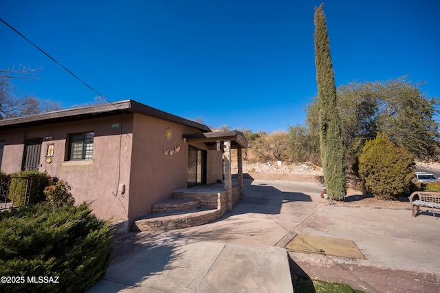 view of property exterior featuring a patio area