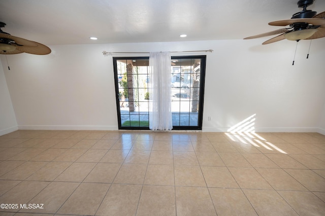 tiled empty room with ceiling fan