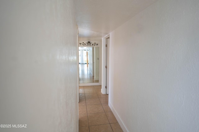 hallway with light tile patterned flooring