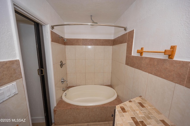 bathroom featuring shower with separate bathtub