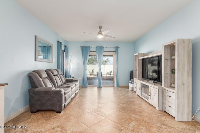 living room with light tile patterned flooring and ceiling fan