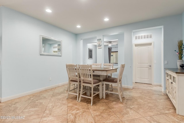 tiled dining room with ceiling fan