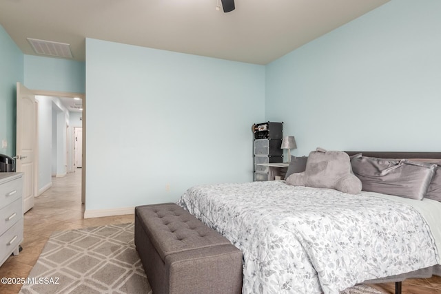 bedroom with light tile patterned floors and ceiling fan