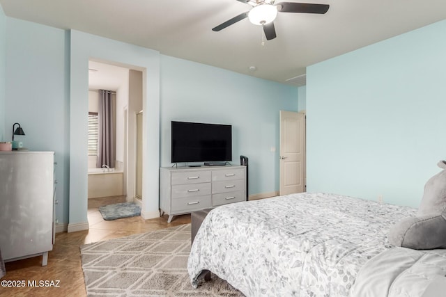 tiled bedroom featuring connected bathroom and ceiling fan