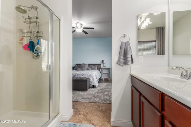 bathroom featuring vanity, plenty of natural light, ceiling fan, and walk in shower