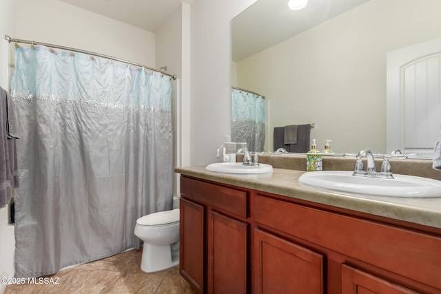 bathroom with vanity, a shower with curtain, and toilet