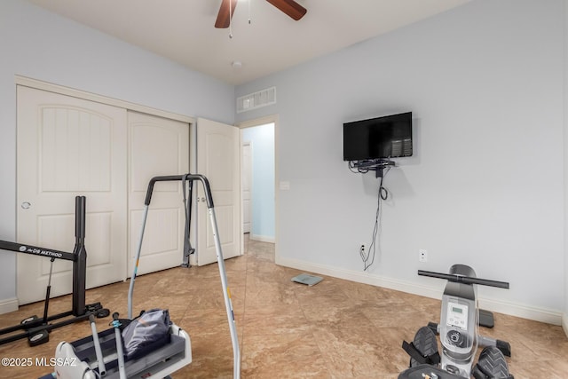 exercise room with ceiling fan