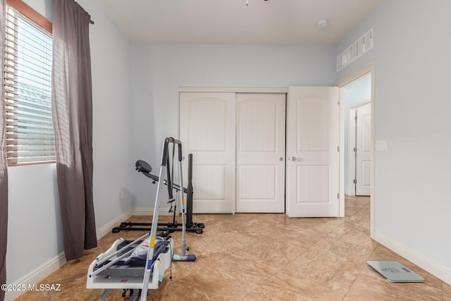 workout room featuring a healthy amount of sunlight