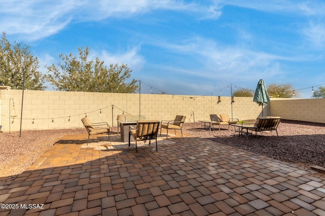 view of patio / terrace with an outdoor fire pit